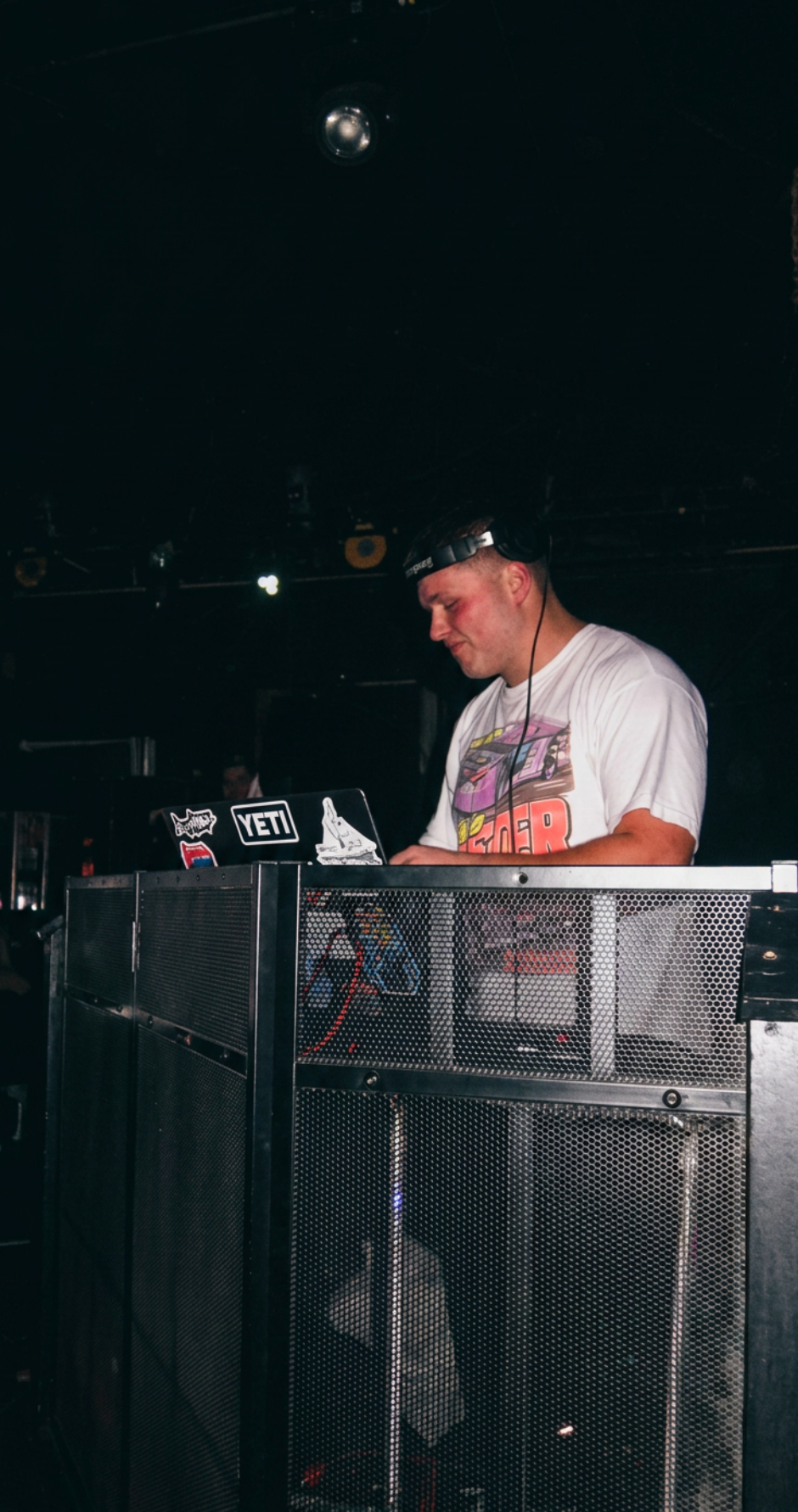 DJ Crim behind the decks at a late-night after-party